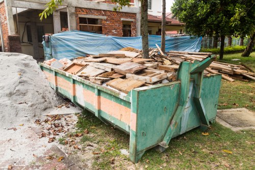 Workers separating office items for recycling in Finchley clearance